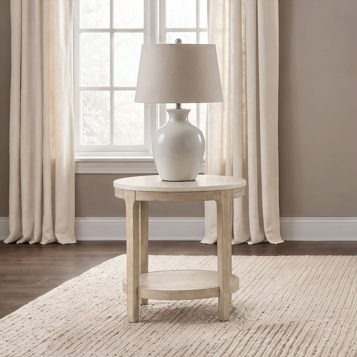 Lucaire Round Cultured Marble Top End Table Honed Cream and Sandstone — room setting