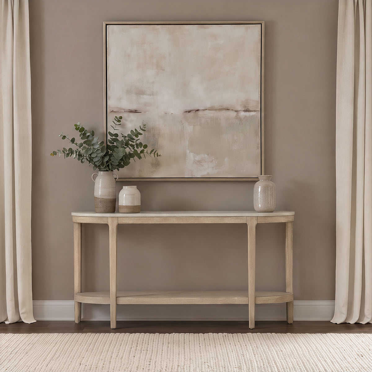Lucaire Oval Cultured Marble Top Console Table Honed Cream and Sandstone — room setting